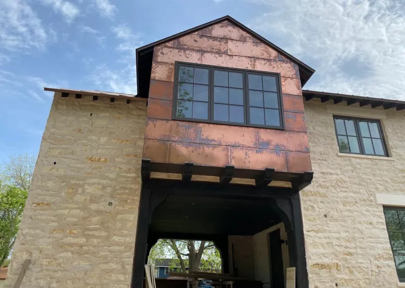 Copper metal panel facade on a stone building for Metal Roof Coating in Wolf Trap